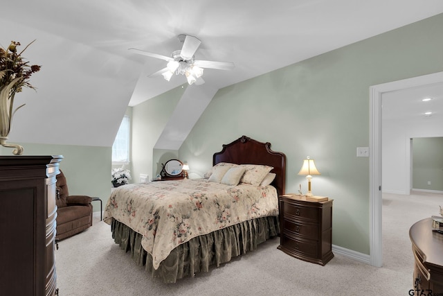 bedroom featuring light carpet, ceiling fan, and vaulted ceiling