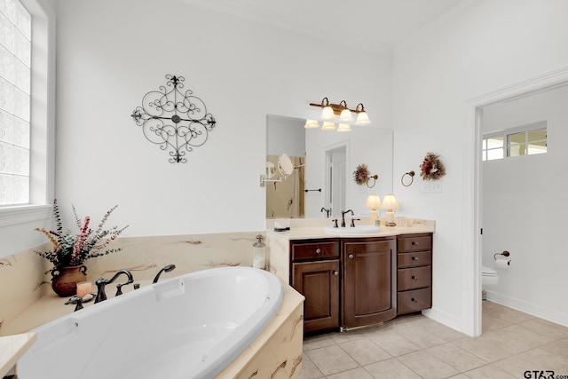 bathroom featuring toilet, tile patterned flooring, plenty of natural light, and crown molding