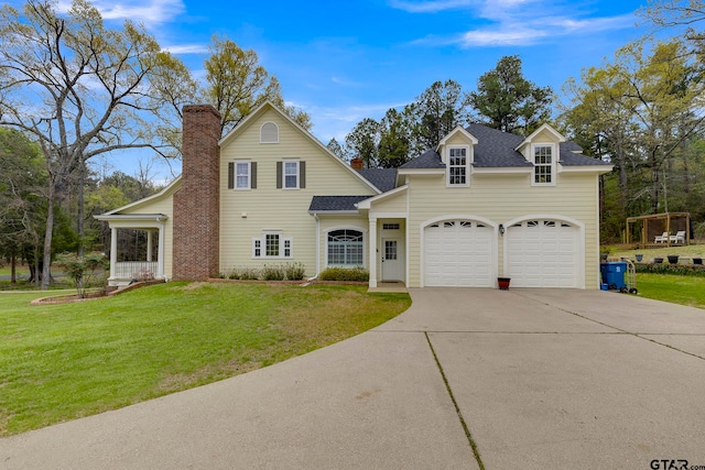 view of front of house with a garage and a front yard