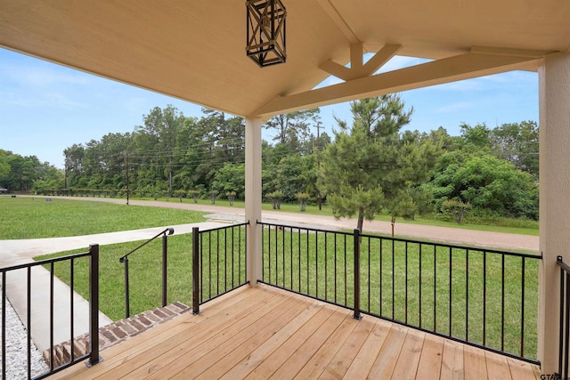 deck featuring a lawn