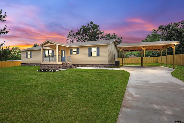 view of front of property with fence, a front lawn, a porch, crawl space, and concrete driveway