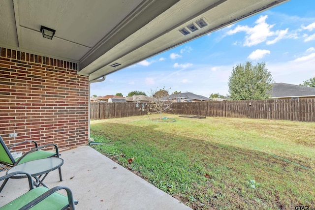 view of yard featuring a fenced backyard and a patio area