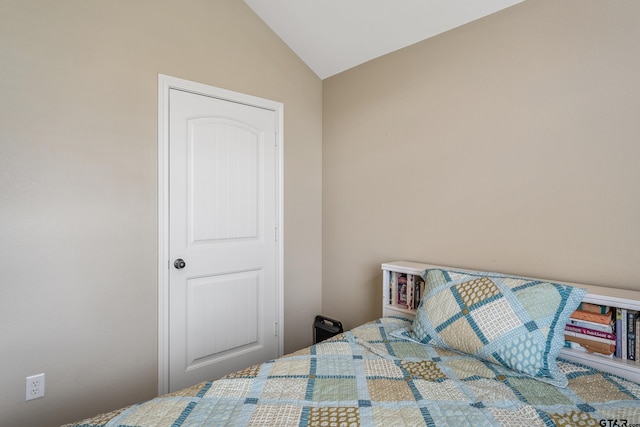 bedroom featuring vaulted ceiling