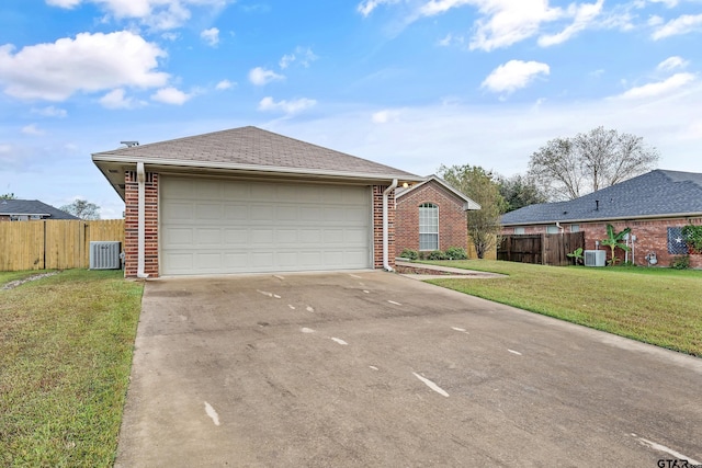 ranch-style home with brick siding, driveway, a front lawn, and fence