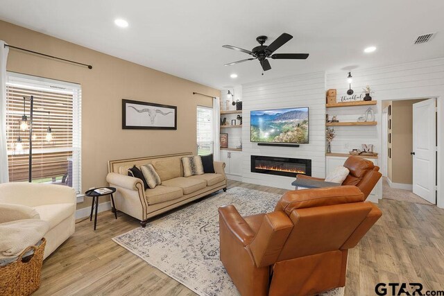 17127 Meadowview Ln, Lindale, TX 75771 - living room featuring recessed lighting, a fireplace, a ceiling fan, and light wood-type flooring