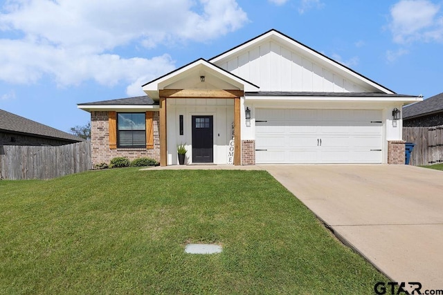 17127 Meadowview Ln, Lindale, TX 75771 - view of front of property featuring brick siding, concrete driveway, board and batten siding, and a garage