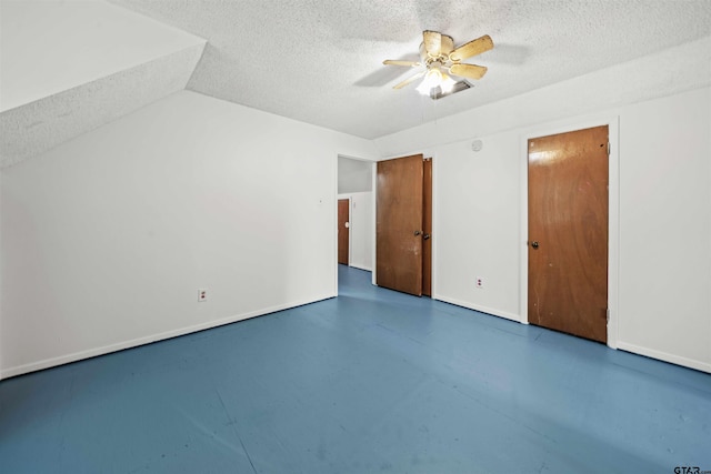 unfurnished bedroom with a textured ceiling and ceiling fan