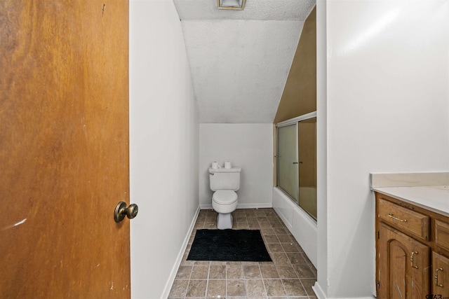 full bathroom with vanity, a textured ceiling, vaulted ceiling, toilet, and combined bath / shower with glass door