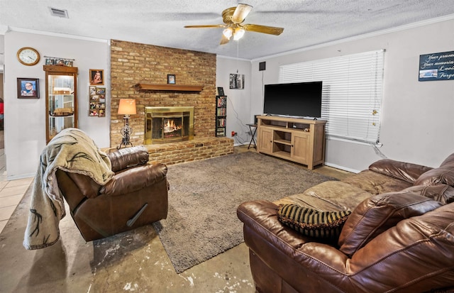 living room featuring crown molding, a textured ceiling, ceiling fan, and a brick fireplace