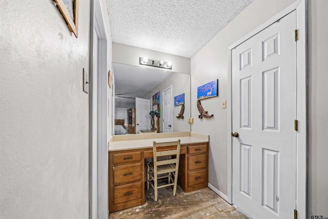 bathroom featuring vanity and a textured ceiling