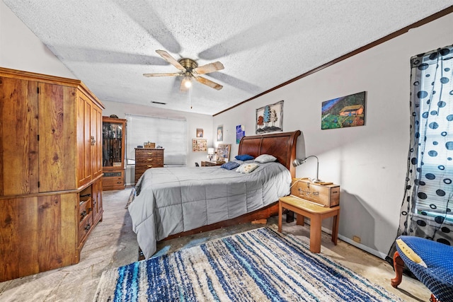 bedroom featuring a textured ceiling, light colored carpet, ceiling fan, and crown molding