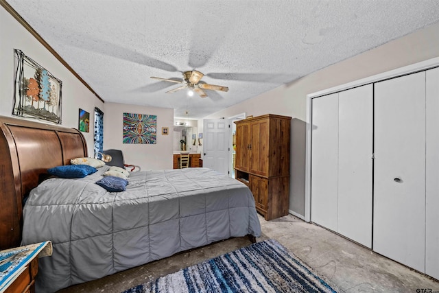 bedroom with a textured ceiling and ceiling fan