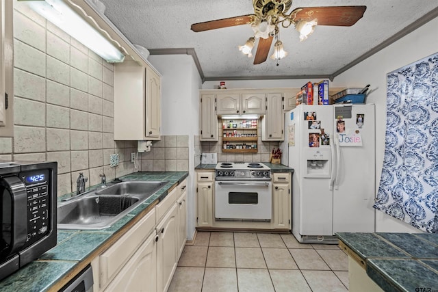 kitchen featuring sink, light tile patterned floors, ornamental molding, ceiling fan, and white appliances