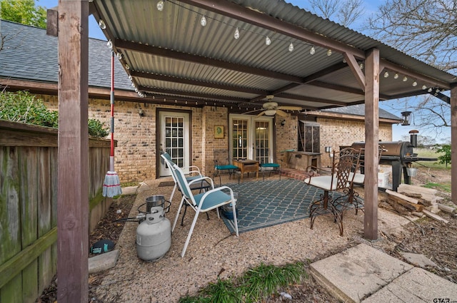 view of patio with area for grilling and ceiling fan