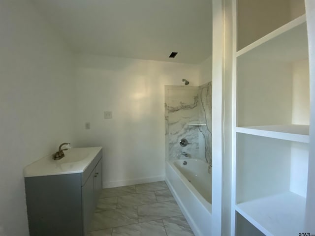 bathroom with vanity and washtub / shower combination