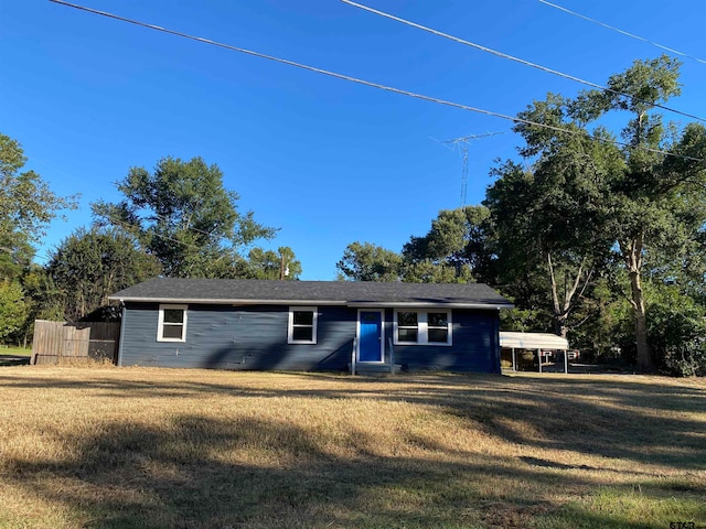 single story home featuring a front yard and a carport