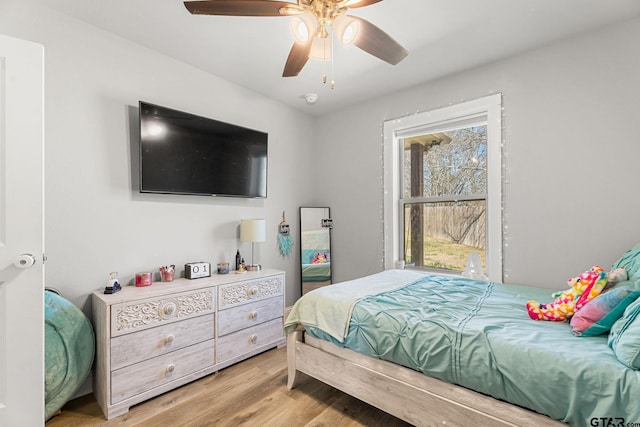 bedroom featuring ceiling fan and light wood-style flooring