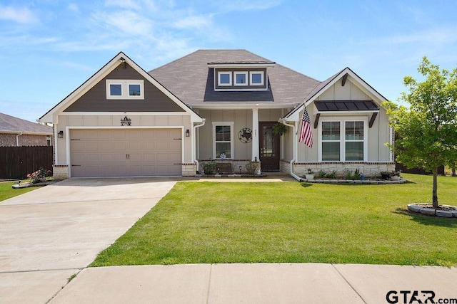 craftsman house featuring a front lawn, driveway, board and batten siding, an attached garage, and fence