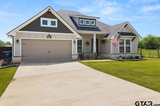 craftsman house with board and batten siding, driveway, roof with shingles, a front lawn, and an attached garage