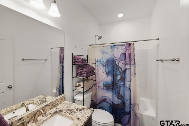 full bathroom with toilet, shower / bath combo with shower curtain, and vanity
