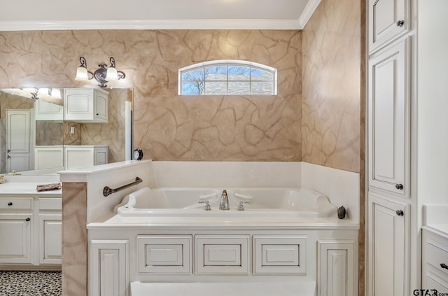 bathroom with a bathing tub, vanity, and crown molding