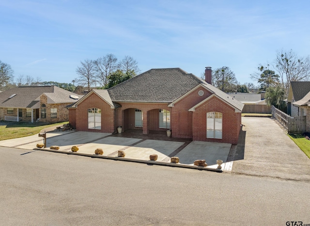 ranch-style house featuring a patio