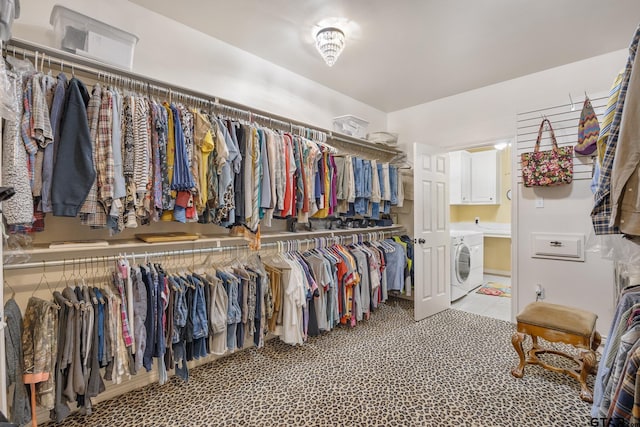 spacious closet featuring washer / clothes dryer