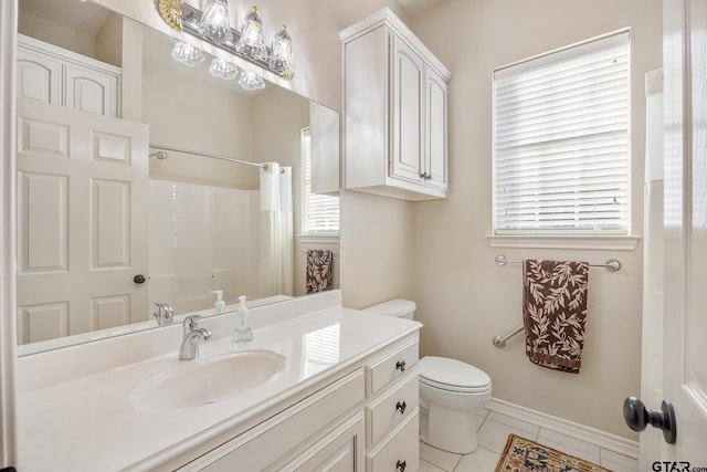 bathroom featuring tile patterned floors, vanity, a shower with shower curtain, and toilet