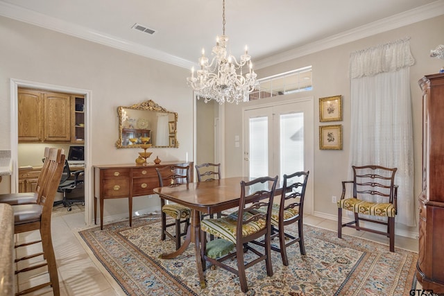 tiled dining area featuring ornamental molding and a chandelier