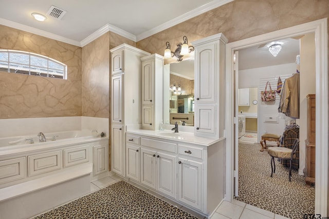 bathroom with a bathing tub, vanity, tile patterned floors, and ornamental molding