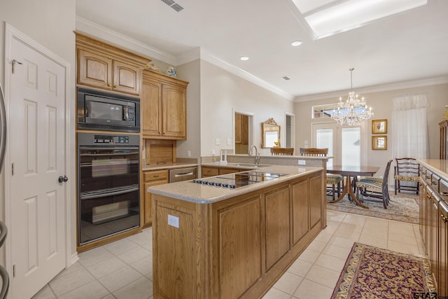 kitchen featuring sink, an inviting chandelier, pendant lighting, light tile patterned floors, and black appliances