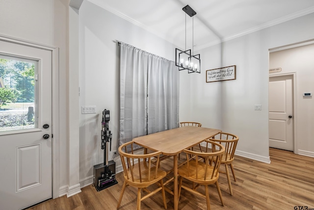 519 Crystal Ave, Rusk, TX 75785 - dining space with ornamental molding, light wood-style floors, a chandelier, and baseboards