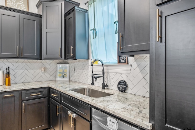 519 Crystal Ave, Rusk, TX 75785 - kitchen with stainless steel dishwasher, a sink, decorative backsplash, and light stone counters