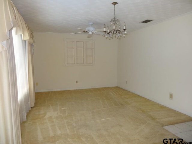 empty room featuring light carpet and ceiling fan with notable chandelier