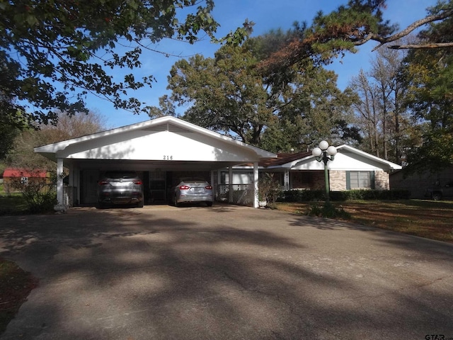 view of front of property featuring a carport