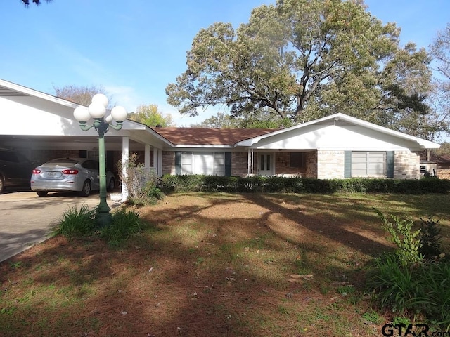 ranch-style home featuring a carport