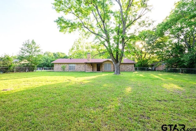 view of yard with a fenced backyard