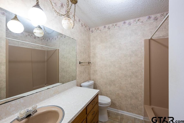 full bath featuring tile patterned floors, toilet, a textured ceiling, and vanity