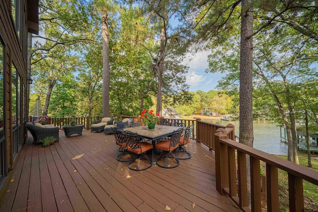 wooden terrace featuring a water view