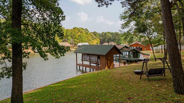 view of dock with a water view and a yard