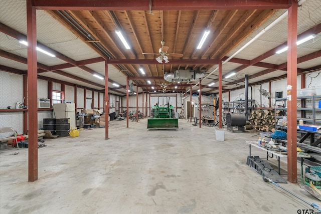 garage with white fridge and ceiling fan