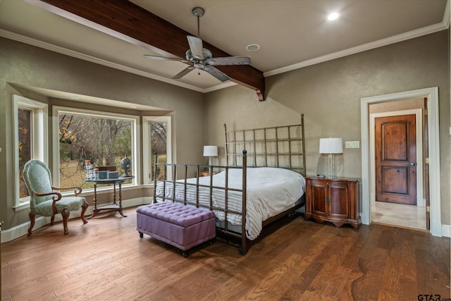 bedroom with ceiling fan, hardwood / wood-style flooring, ornamental molding, and beamed ceiling