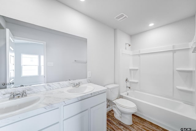 205 Highland Forest Dr, Gilmer, TX 75644 - full bath with toilet, double vanity, washtub / shower combination, wood finished floors, and recessed lighting