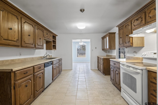 kitchen with white electric range, dishwasher, ceiling fan, light tile patterned floors, and sink