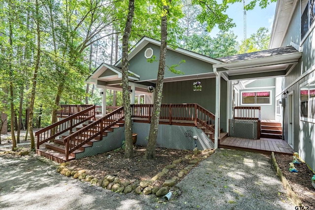 381 Winding Trl, Holly Lake Ranch, TX 75765 - view of front of property with stairs and a deck
