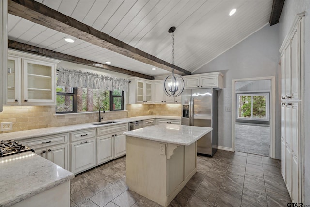 381 Winding Trl, Holly Lake Ranch, TX 75765 - kitchen with appliances with stainless steel finishes, a sink, wood ceiling, a kitchen island, and healthy amount of natural light