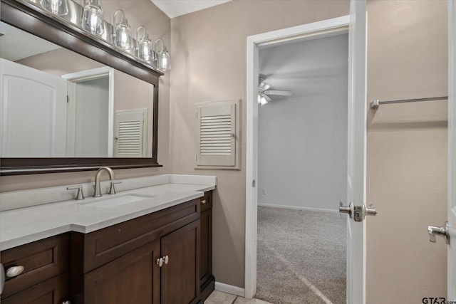 381 Winding Trl, Holly Lake Ranch, TX 75765 - bathroom with vanity, a ceiling fan, and baseboards