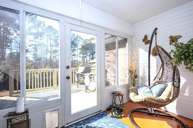 doorway to outside with crown molding