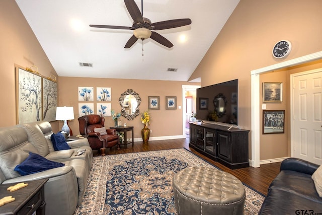 living room with baseboards, visible vents, and wood finished floors