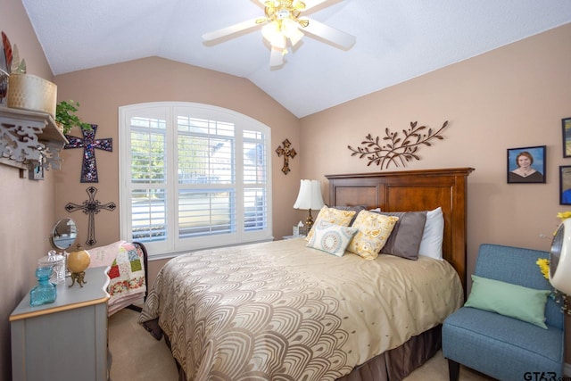 bedroom with a ceiling fan, carpet, and vaulted ceiling